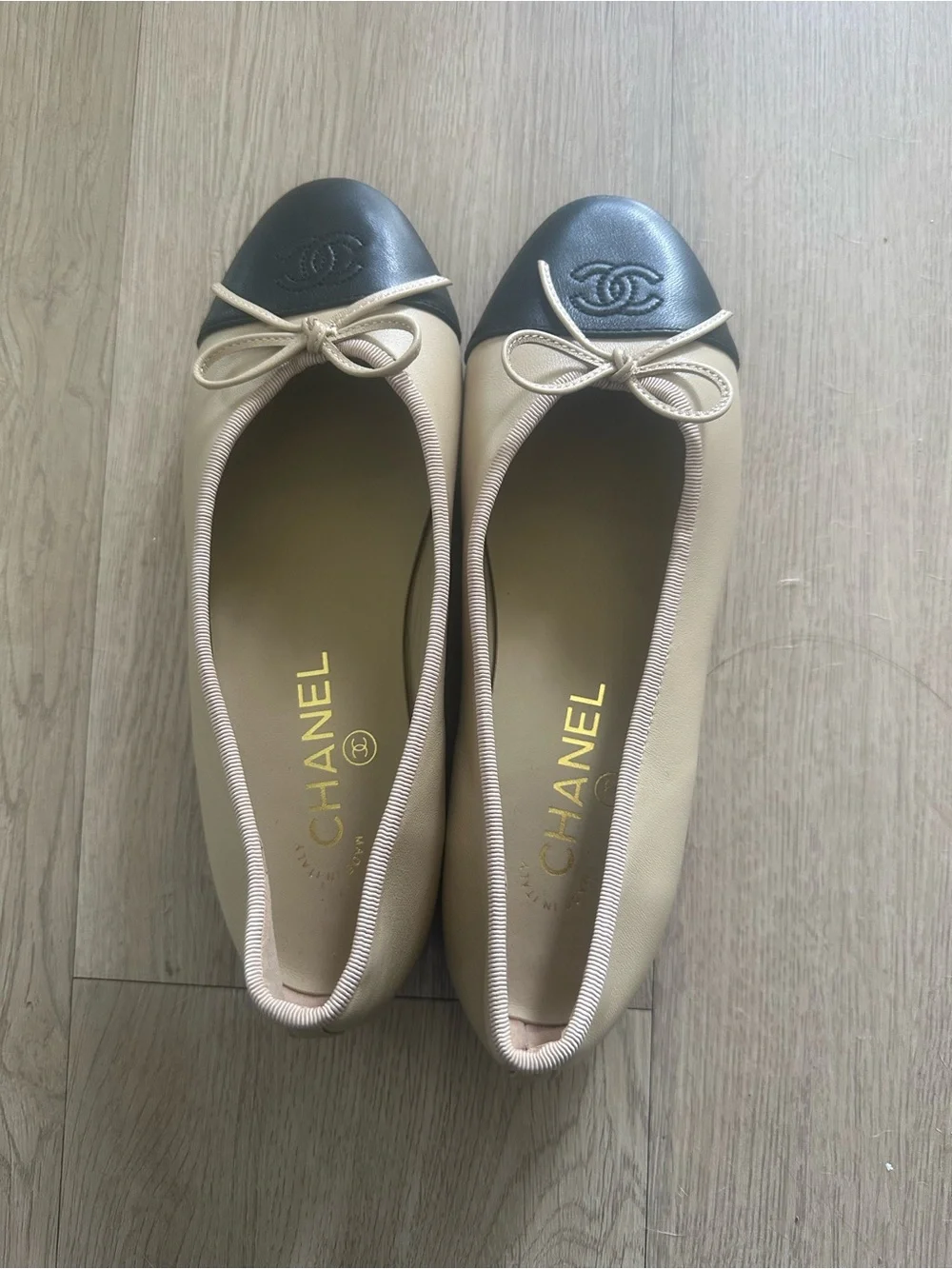 CHANEL Beige Leather Ballet Flats with Black Cap Toe